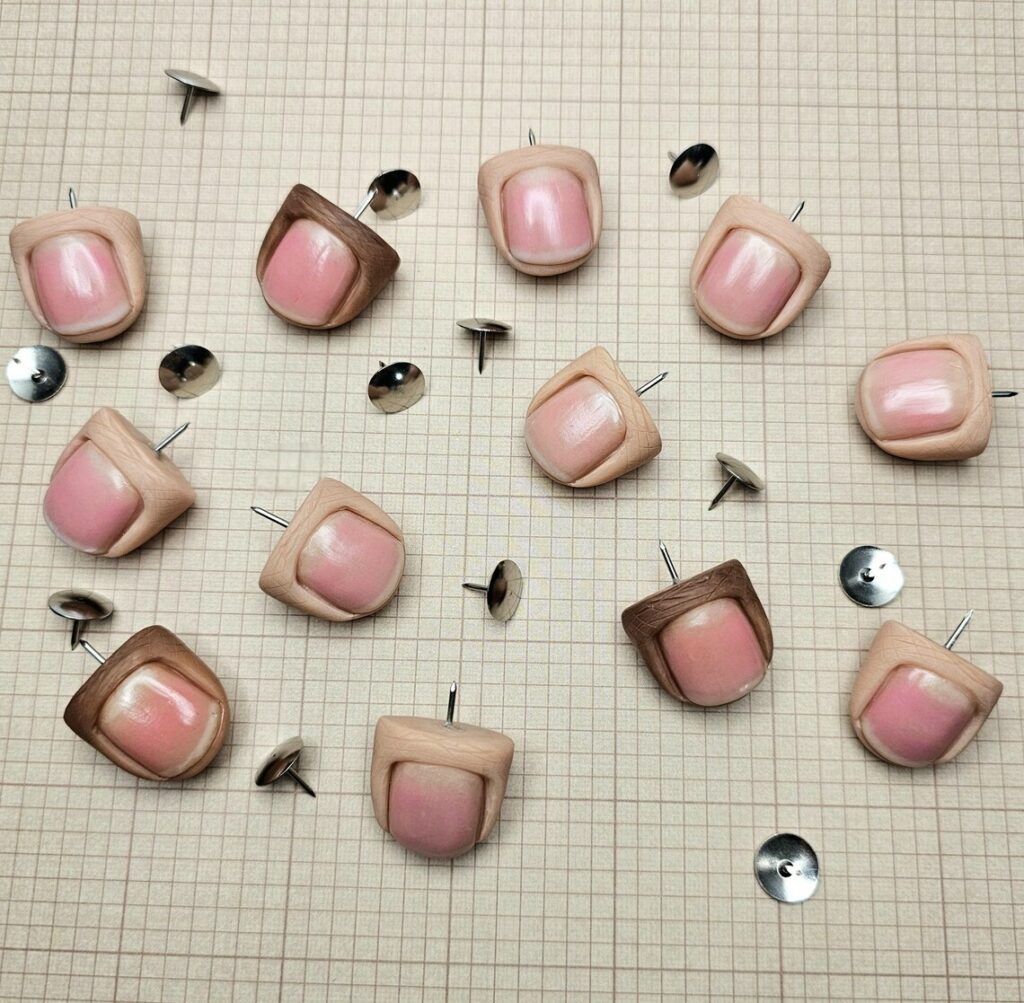 human thumb tacks
